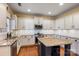 Spacious kitchen featuring granite countertops and white cabinets at 114 Runningdeer Dr, Mooresville, NC 28117