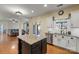 Kitchen island with granite top overlooks Gathering room at 114 Runningdeer Dr, Mooresville, NC 28117