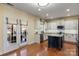 Kitchen with island, stainless steel appliances, and French doors to patio at 114 Runningdeer Dr, Mooresville, NC 28117