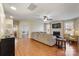 Open living room with hardwood floors, fireplace and kitchen view at 114 Runningdeer Dr, Mooresville, NC 28117