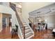 Grand staircase with wrought iron railing leading to the upper level at 114 Runningdeer Dr, Mooresville, NC 28117