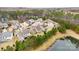 Aerial view of a residential neighborhood with pond at 11519 Sweet Birch Ln, Charlotte, NC 28278
