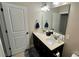 Bathroom with double sinks and a large mirror at 11519 Sweet Birch Ln, Charlotte, NC 28278