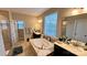 Bathroom with a large soaking tub and double vanity at 11519 Sweet Birch Ln, Charlotte, NC 28278