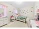 Charming bedroom with a playful decor and ample natural light at 11519 Sweet Birch Ln, Charlotte, NC 28278