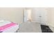 Bright, carpeted bedroom with ample closet space and a view of hallway at 11519 Sweet Birch Ln, Charlotte, NC 28278