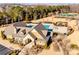Stunning community clubhouse featuring a pool, playground, tennis courts, and well-manicured landscaping at 11519 Sweet Birch Ln, Charlotte, NC 28278