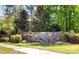 Stone sign at the entrance to Chapel Cove, a community surrounded by lush greenery at 11519 Sweet Birch Ln, Charlotte, NC 28278