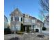 Two-story house with gray siding, black shutters, and a two-car garage at 11519 Sweet Birch Ln, Charlotte, NC 28278