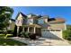 Attractive two-story home features a two-car garage, manicured landscaping, and a covered front porch at 11519 Sweet Birch Ln, Charlotte, NC 28278