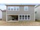 Gray house exterior with a covered patio and grassy yard at 11519 Sweet Birch Ln, Charlotte, NC 28278