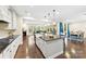 Bright, open kitchen with a large island, stainless appliances, and hardwood floors at 11519 Sweet Birch Ln, Charlotte, NC 28278