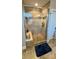 Large walk-in shower with tiled walls and built-in seating at 11519 Sweet Birch Ln, Charlotte, NC 28278