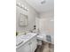 Clean bathroom with white vanity, bathtub, and vinyl flooring at 116 Westover Ave, Kannapolis, NC 28081