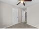 Bedroom with carpet, ceiling fan, and double doors at 116 Westover Ave, Kannapolis, NC 28081