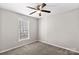 Spacious bedroom with ceiling fan and window at 116 Westover Ave, Kannapolis, NC 28081