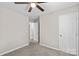 Bedroom with ceiling fan and access to hallway at 116 Westover Ave, Kannapolis, NC 28081