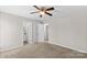 Primary bedroom with ceiling fan and access to a private bathroom at 116 Westover Ave, Kannapolis, NC 28081