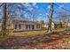 Front view of a charming house with a yard and mature trees at 116 Westover Ave, Kannapolis, NC 28081