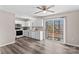 Galley kitchen with white cabinets, appliances, and access to deck at 116 Westover Ave, Kannapolis, NC 28081