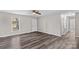 Living room features vinyl flooring, neutral walls, and access to other rooms at 116 Westover Ave, Kannapolis, NC 28081