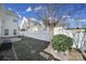 Small, fenced backyard with grassy area at 11615 Kingsley View Dr, Charlotte, NC 28277