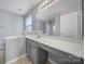 Bathroom features vanity, mirror and tile flooring at 11615 Kingsley View Dr, Charlotte, NC 28277