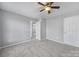 Bedroom with ceiling fan and access to hallway at 11615 Kingsley View Dr, Charlotte, NC 28277