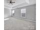 Large bedroom with ceiling fan and ample natural light at 11615 Kingsley View Dr, Charlotte, NC 28277