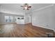 Open concept dining area with hardwood floors and kitchen view at 11615 Kingsley View Dr, Charlotte, NC 28277