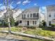 Charming two-story home features a welcoming porch, a landscaped yard, and classic architectural details at 11615 Kingsley View Dr, Charlotte, NC 28277