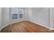 Small office space with hardwood floors and neutral walls at 11615 Kingsley View Dr, Charlotte, NC 28277