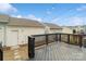 Backyard with deck, string lights and view of storage units at 12515 Bryton Ridge Pkwy, Huntersville, NC 28078