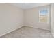 Simple carpeted bedroom with a window at 12515 Bryton Ridge Pkwy, Huntersville, NC 28078