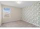 Bedroom with leafy wallpaper and window at 12515 Bryton Ridge Pkwy, Huntersville, NC 28078