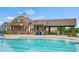 Community pool with clubhouse and shaded seating at 12515 Bryton Ridge Pkwy, Huntersville, NC 28078