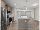 Modern kitchen with stainless steel appliances and an island at 12515 Bryton Ridge Pkwy, Huntersville, NC 28078