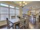 Dining room featuring hardwood floors, natural light and an open floor plan into the kitchen and living room at 1255 Restoration Dr, Waxhaw, NC 28173