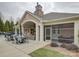 Community outdoor area with a pool, covered lounge with fireplace, and dining space for residents' enjoyment at 1255 Restoration Dr, Waxhaw, NC 28173