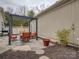 Inviting patio area with stone pavers, a pergola, and comfortable seating, perfect for outdoor relaxation at 1255 Restoration Dr, Waxhaw, NC 28173