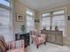 Sitting room featuring colorful chairs, windows with blinds, light colored walls and matching side tables at 1255 Restoration Dr, Waxhaw, NC 28173