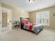 Charming bedroom with rustic headboard and window with plantation shutters at 12835 Cadgwith Cove Dr, Huntersville, NC 28078