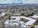 Aerial view of a modern apartment building with city skyline in background at 1323 Queens Rd # 407, Charlotte, NC 28207