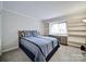 Spacious bedroom with built-in shelving and window seat at 1323 Queens Rd # 407, Charlotte, NC 28207