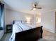 Cozy bedroom with ceiling fan and ensuite bathroom access at 1323 Queens Rd # 407, Charlotte, NC 28207