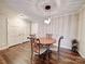 Bright dining area with wood floors and charming table set at 1323 Queens Rd # 407, Charlotte, NC 28207