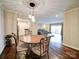 Round wooden table with four chairs in a well-lit dining area at 1323 Queens Rd # 407, Charlotte, NC 28207