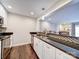 Updated kitchen featuring granite countertops and white cabinets at 1323 Queens Rd # 407, Charlotte, NC 28207