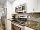 Modern kitchen features stainless steel appliances and granite countertops at 1323 Queens Rd # 407, Charlotte, NC 28207