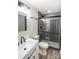 Bathroom with gray herringbone tile shower and white vanity at 139 Elysian Dr, Mooresville, NC 28117